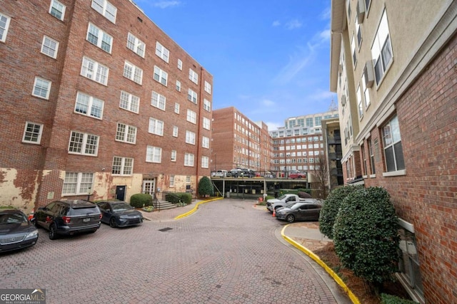 view of property featuring uncovered parking