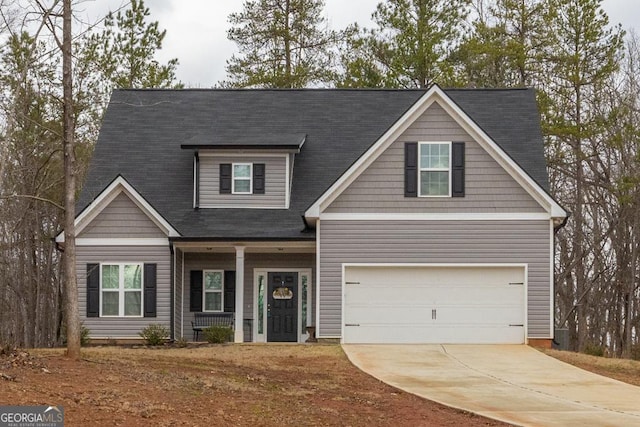 craftsman-style home featuring a garage and concrete driveway