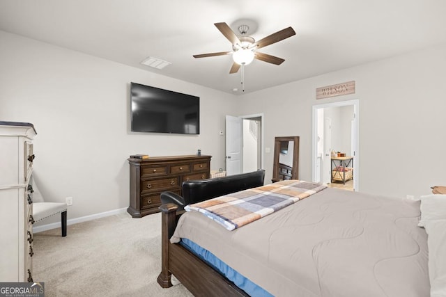 bedroom with light carpet, visible vents, baseboards, and a ceiling fan