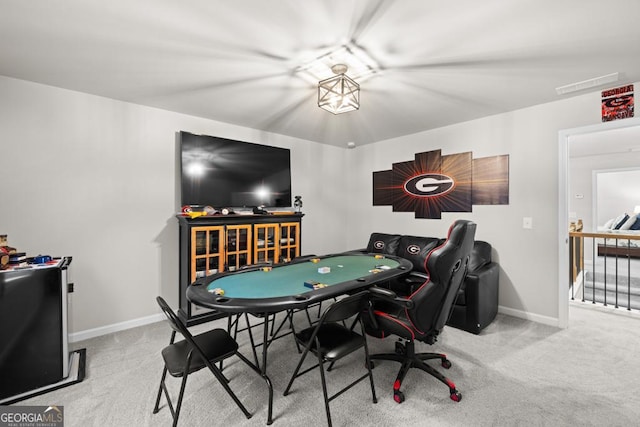 playroom with carpet floors and baseboards