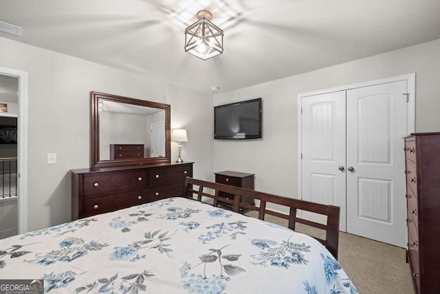 bedroom featuring carpet, a closet, and visible vents