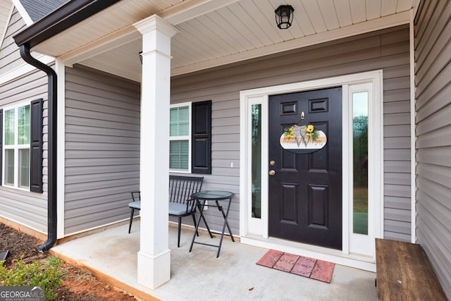 doorway to property featuring a porch