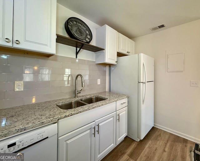 kitchen with white appliances, a sink, visible vents, white cabinets, and open shelves