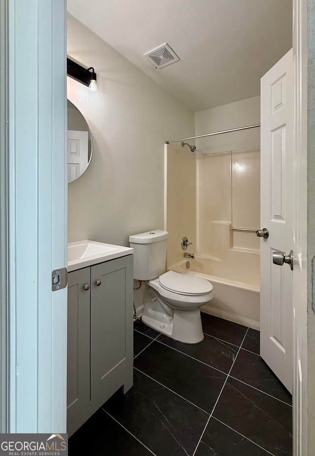 bathroom featuring toilet, vanity, visible vents,  shower combination, and tile patterned floors