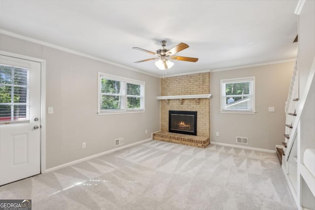 unfurnished living room with carpet floors, ornamental molding, and visible vents