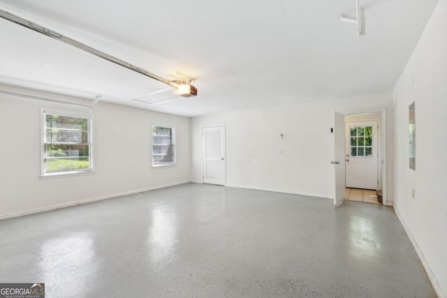 interior space featuring speckled floor and baseboards