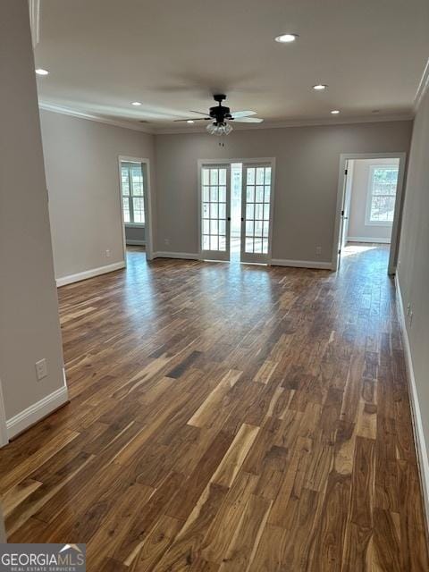 unfurnished room featuring baseboards, dark wood-type flooring, crown molding, and recessed lighting