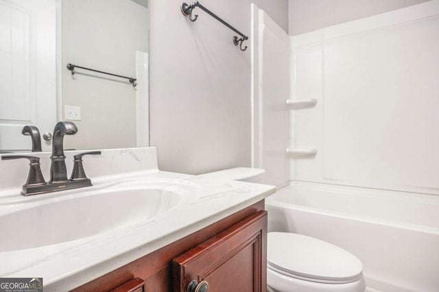 bathroom featuring shower / tub combination, vanity, and toilet