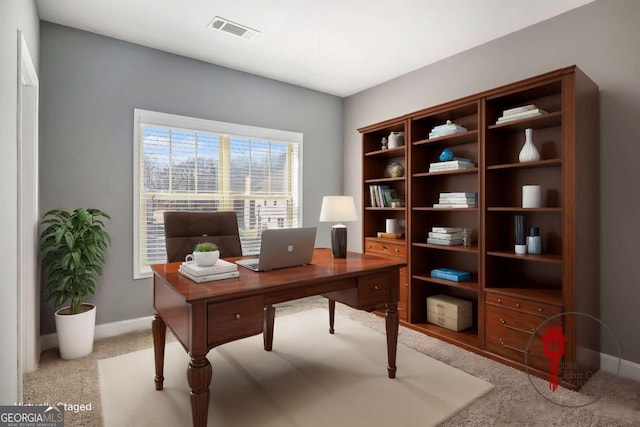 office space with carpet, visible vents, and baseboards