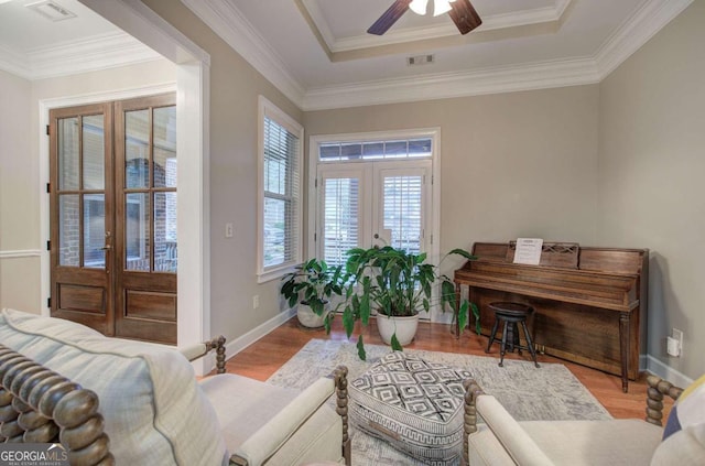 sitting room featuring visible vents, wood finished floors, and french doors