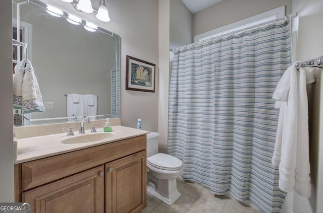 bathroom featuring curtained shower, vanity, toilet, and tile patterned floors