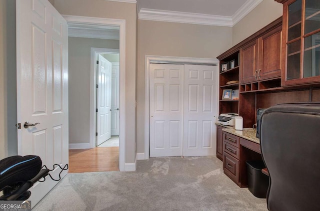 home office with ornamental molding, light carpet, and baseboards