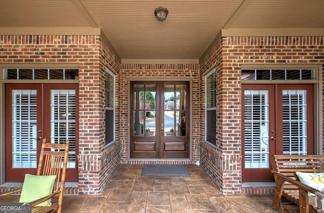 entrance to property with french doors and brick siding