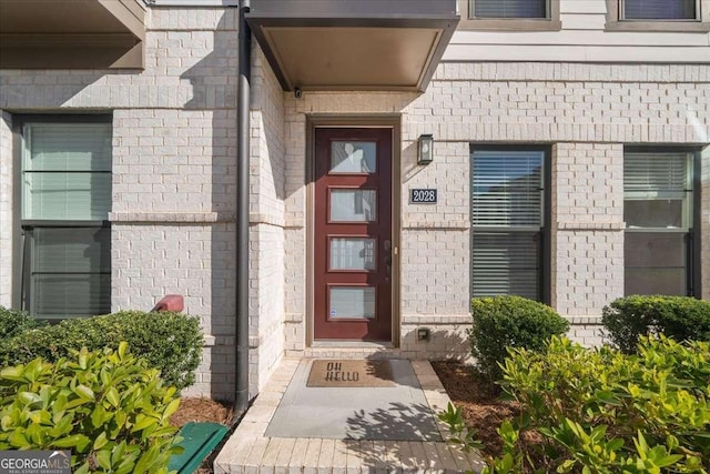 entrance to property with brick siding