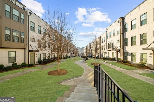 surrounding community featuring a residential view and a lawn