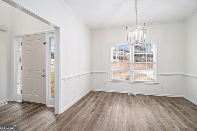 1320 Kay Ter SE, Conyers, GA 30013 - entryway with an inviting chandelier, visible vents, wood finished floors, and ornamental molding