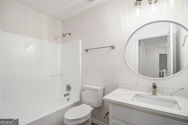 full bath with bathtub / shower combination, vanity, and toilet