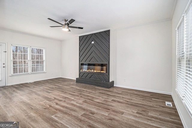 1320 Kay Ter SE, Conyers, GA 30013 - unfurnished living room with crown molding, visible vents, and ceiling fan