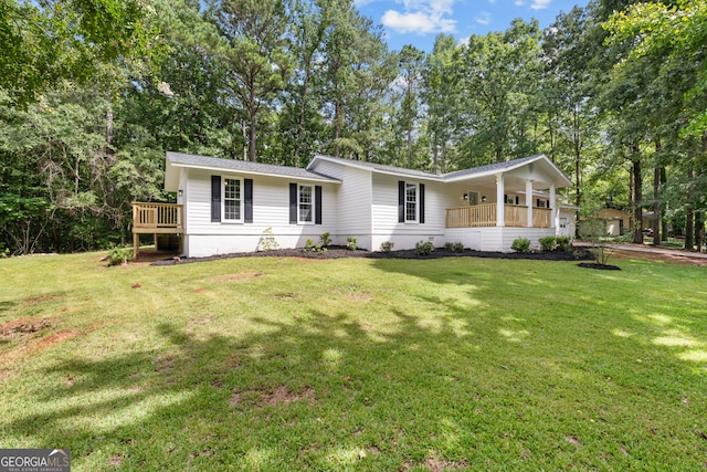 single story home with a porch and a front lawn