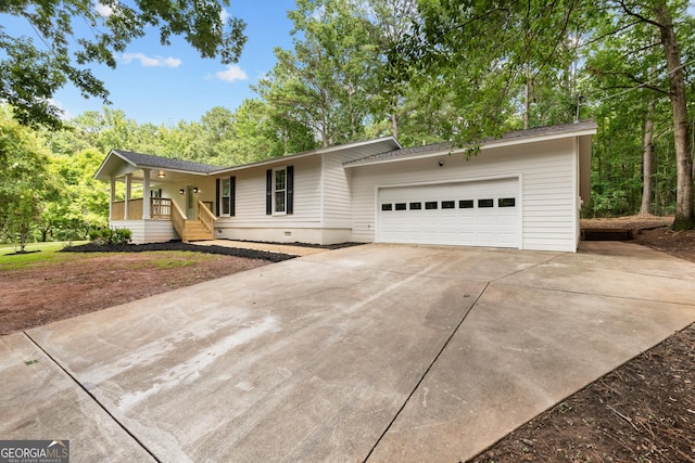 ranch-style home with concrete driveway, crawl space, an attached garage, and roof with shingles