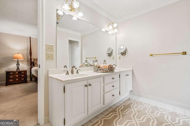 ensuite bathroom with ornamental molding, connected bathroom, a sink, and double vanity