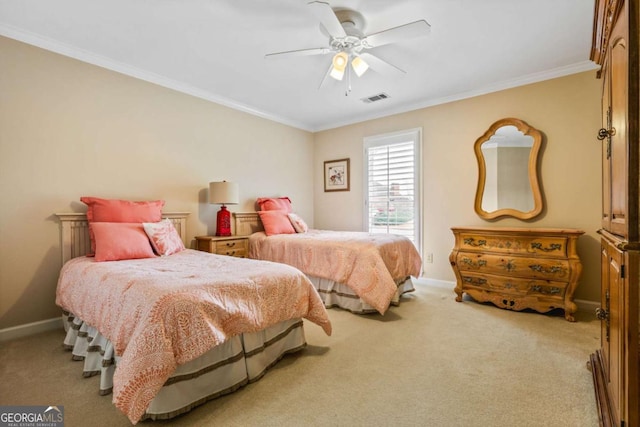 carpeted bedroom with ceiling fan, ornamental molding, visible vents, and baseboards