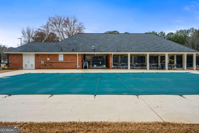 community pool with a patio area