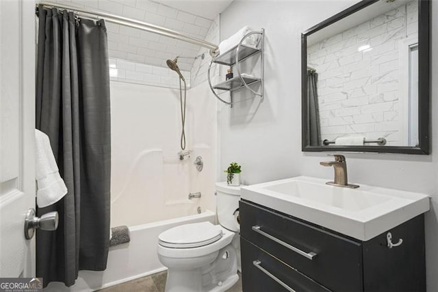 full bath featuring vanity, shower / bath combo with shower curtain, and toilet