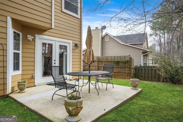 view of patio / terrace with fence and french doors