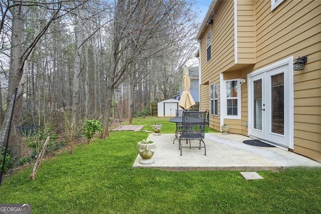 view of yard with an outbuilding and a patio