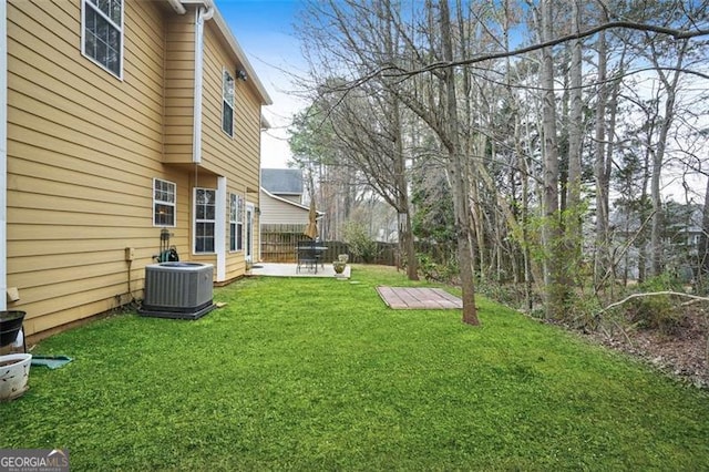 view of yard featuring a patio, cooling unit, and fence