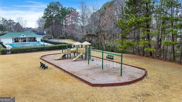 community play area with a lawn