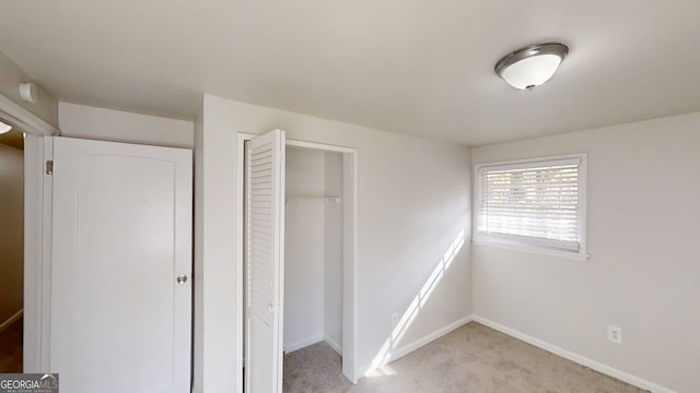 2134 Elinwood Dr, Atlanta, GA 30344 - unfurnished bedroom with light colored carpet and a closet