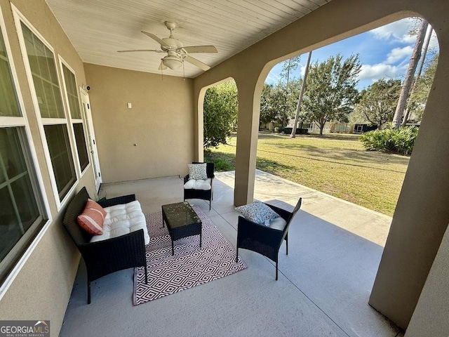 view of patio featuring outdoor lounge area and a ceiling fan