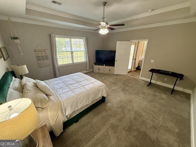 bedroom featuring baseboards, ceiling fan, ornamental molding, carpet, and a tray ceiling