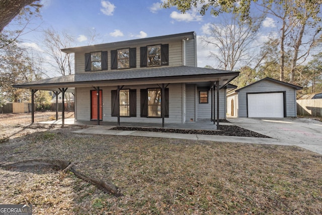 farmhouse with covered porch, fence, a garage, driveway, and an outdoor structure