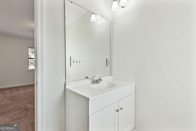 bathroom featuring vanity and baseboards