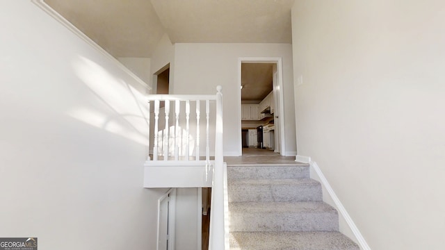 stairs featuring baseboards