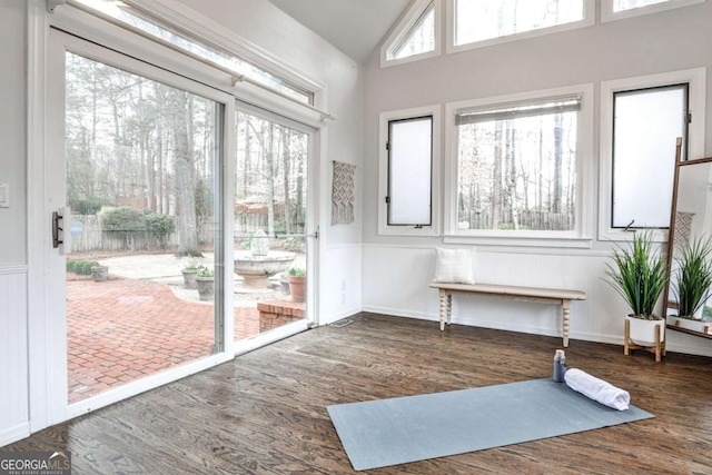 unfurnished sunroom with lofted ceiling