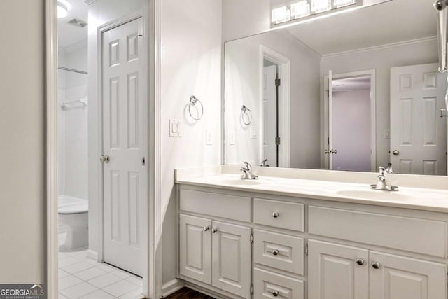 full bathroom with double vanity, visible vents, ornamental molding, tile patterned floors, and a sink