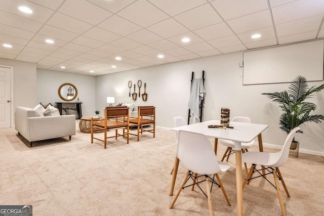 dining space featuring recessed lighting, light colored carpet, a paneled ceiling, and baseboards