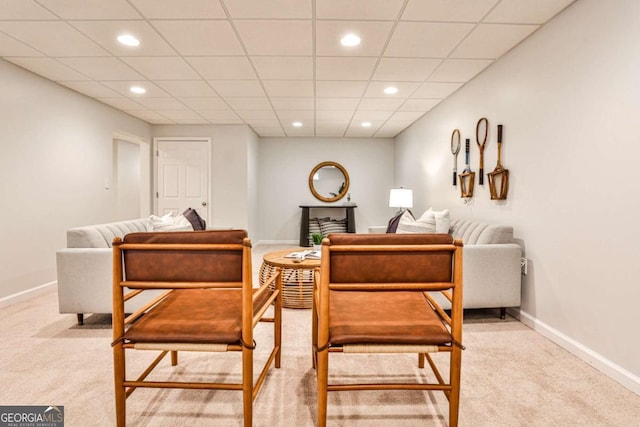 interior space with baseboards, a drop ceiling, and recessed lighting