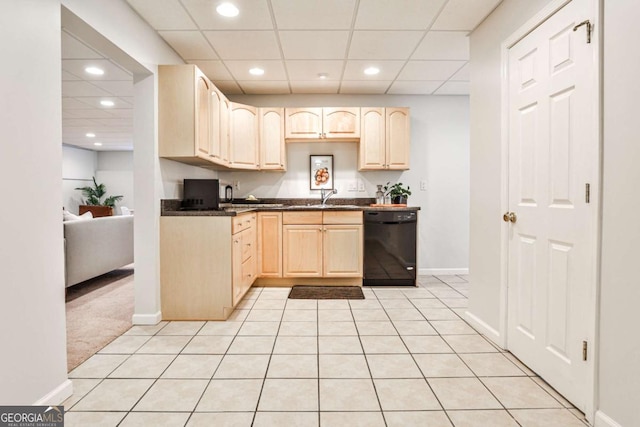 kitchen with black dishwasher, dark countertops, recessed lighting, light brown cabinetry, and a sink