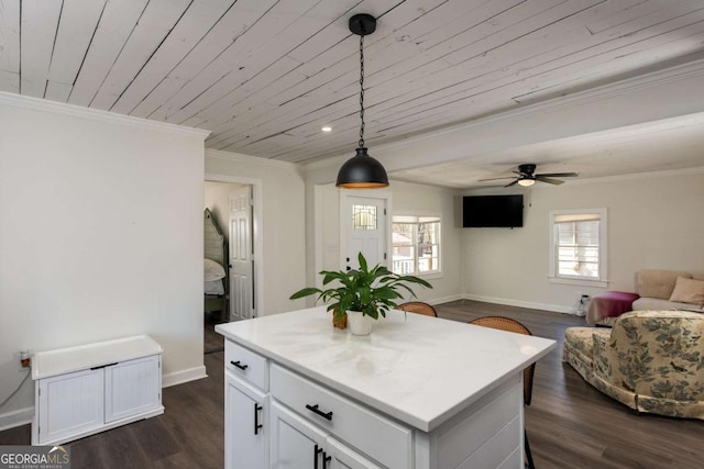 kitchen featuring baseboards, wood ceiling, dark wood-type flooring, crown molding, and white cabinetry