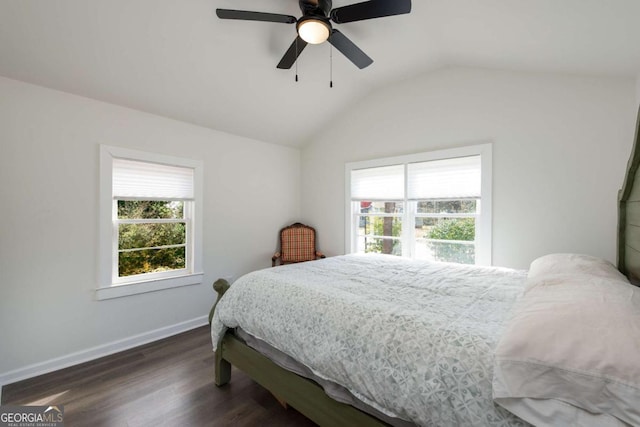 bedroom with lofted ceiling, a ceiling fan, baseboards, and wood finished floors