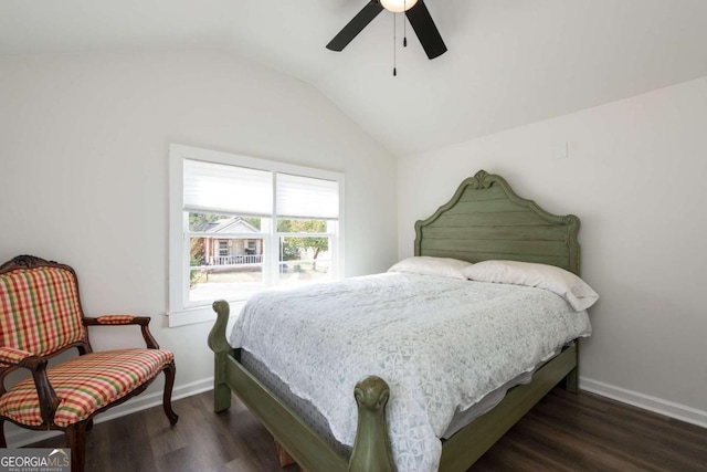 bedroom featuring ceiling fan, vaulted ceiling, baseboards, and wood finished floors