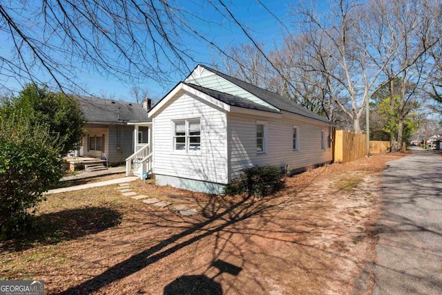 view of side of property with fence