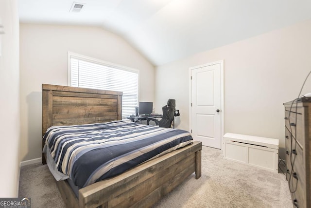 bedroom featuring vaulted ceiling, baseboards, visible vents, and light colored carpet