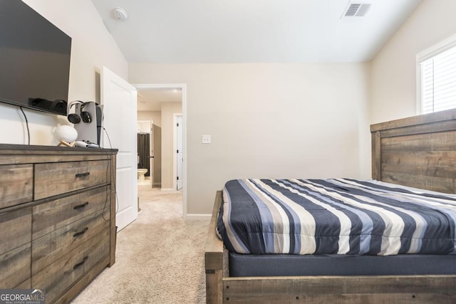 bedroom featuring baseboards, visible vents, and light colored carpet