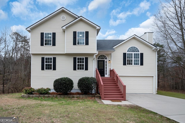 view of front of property featuring an attached garage, a chimney, concrete driveway, and a front yard